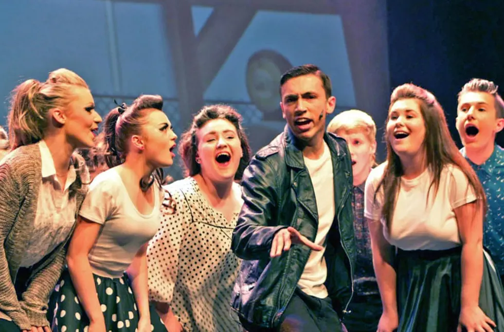 Students singinf in a performance