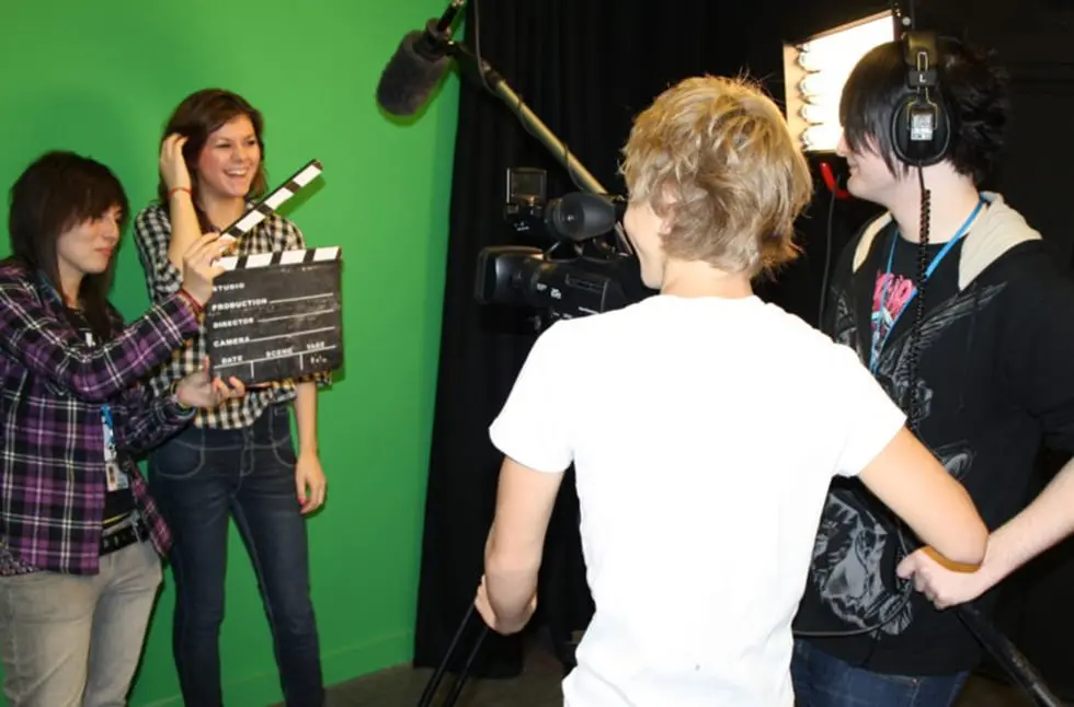 Media students filming in front of a greenscreen
