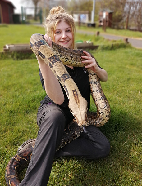 Animal Zone Keeper Chloe holding a snake