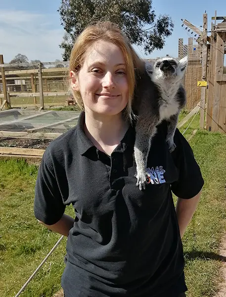Animal Zone Keeper Lisa with a lemur on her shoulder
