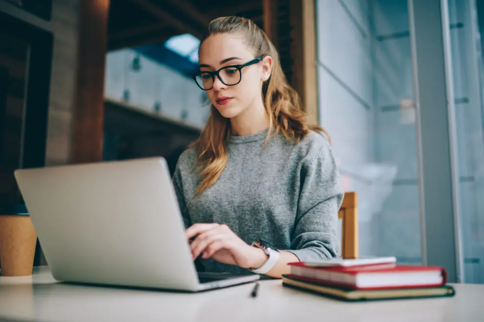 Woman typing on her computer