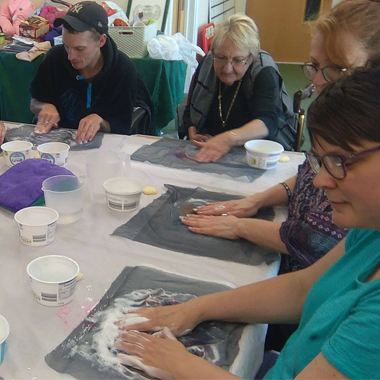 Adults taking part in arts and crafts activities