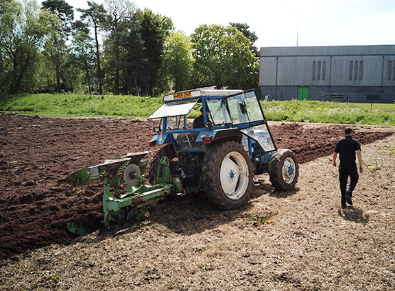 A tractor ploughing a field