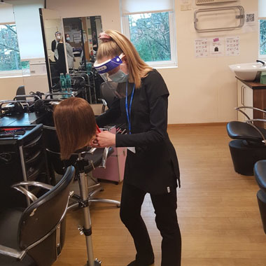 Hairdressing student practicing