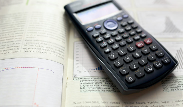 Calculator on top of a maths textbook