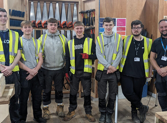 Carpentry students with Dan Tucker 730x425