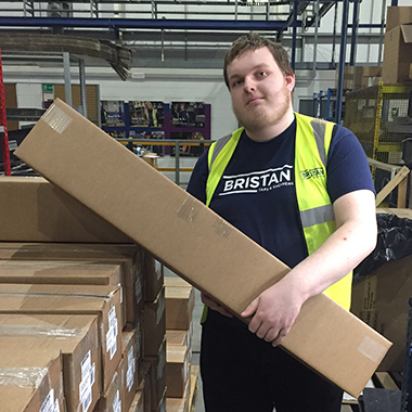 Dom Birch, Supported internships student holding a box on work placement