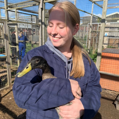 Photo of student Emily Radford holding duck