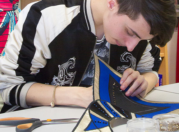 A student working with fabric