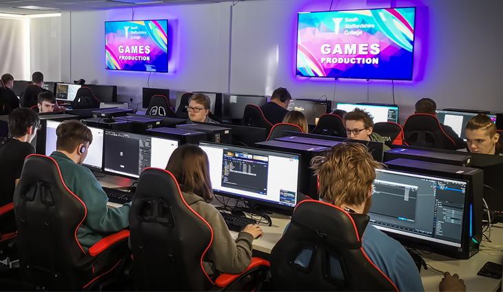 Photo of Games Production students working on computers in the Lichfield Games Hub