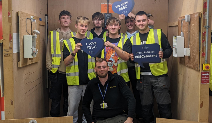 Group of electrical students at Tamworth with photo props