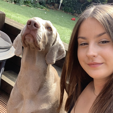 Photo of student Hannah Oliver with dog