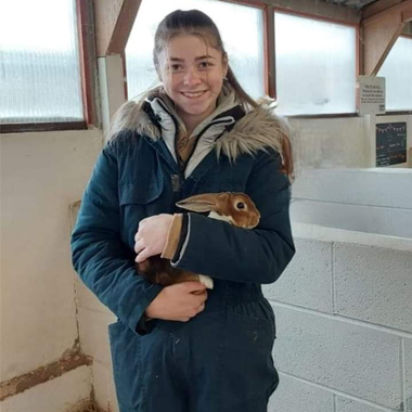 Photo of student Isabel Taylor holding a rabbit
