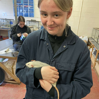 Photo of student Lily Kennedy holding a rodent