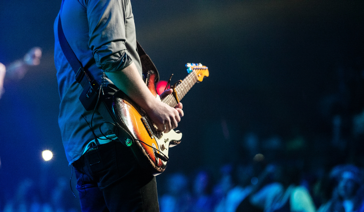 Man playing guitar on stage