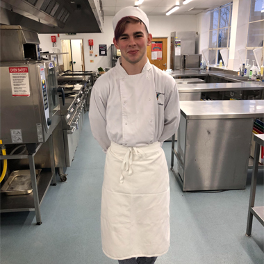 Photograph of Owen Gardiner in Tamworth College's commercial kitchen