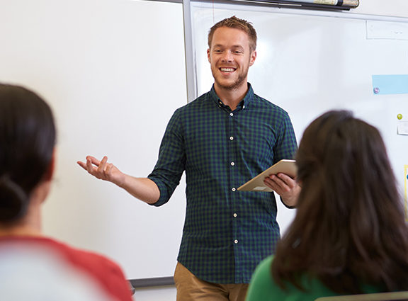 Teacher presenting to pupils