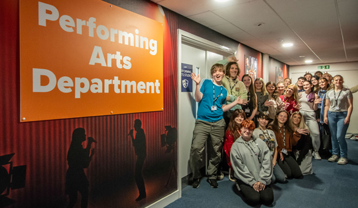 Performing Arts students with new signage