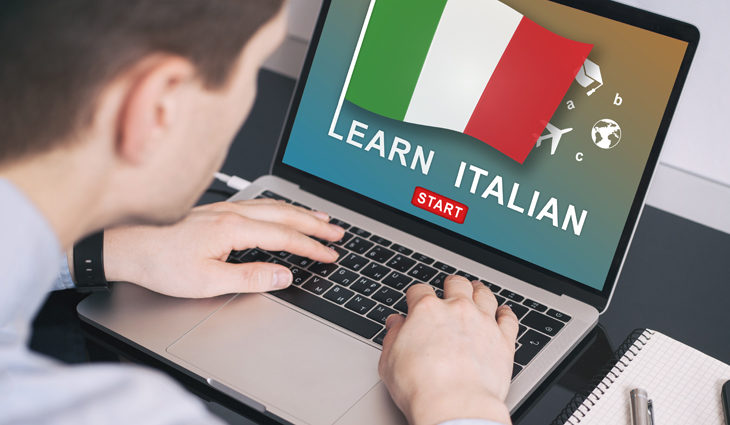 Person learning to speak Italian on a laptop