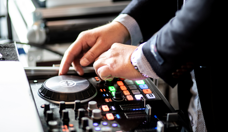 Person using decks to DJ