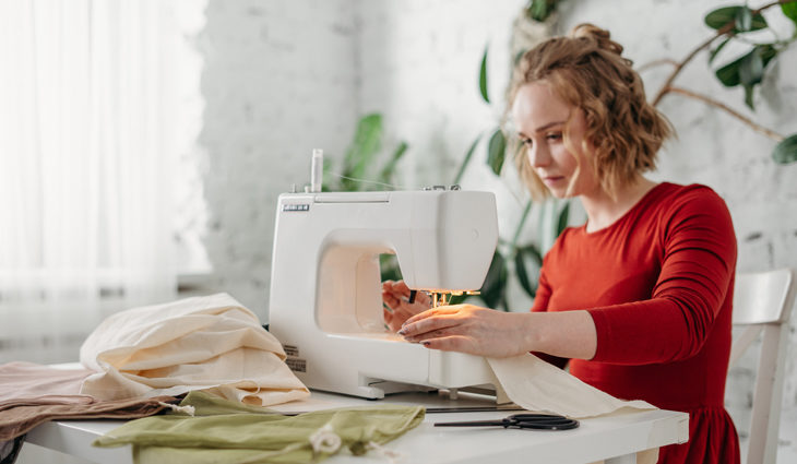 Person using sewing machine