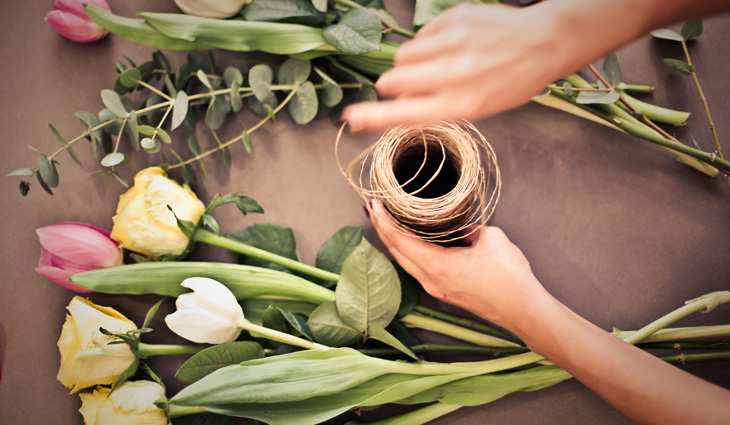 Person's Hand Near Flowers