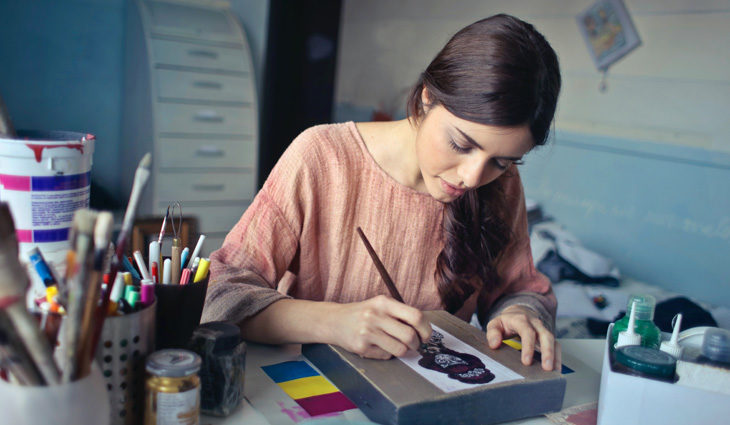 Woman painting in art studio