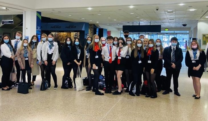 Travel students with Emirates staff at Birmingham airport