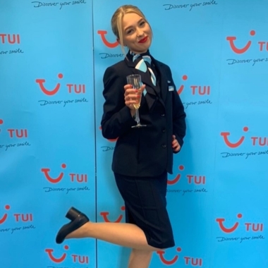Photo of former Travel and Tourism student Alex Hyde graduating TUI training