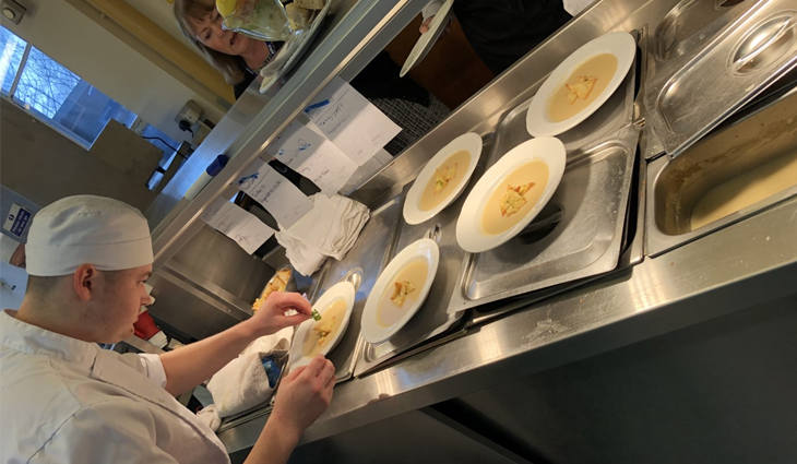 Catering student preparing dishes in the kitchen