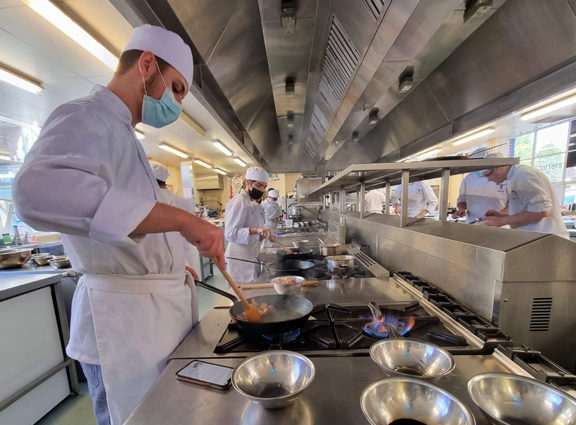 Catering students cooking in the kitchen