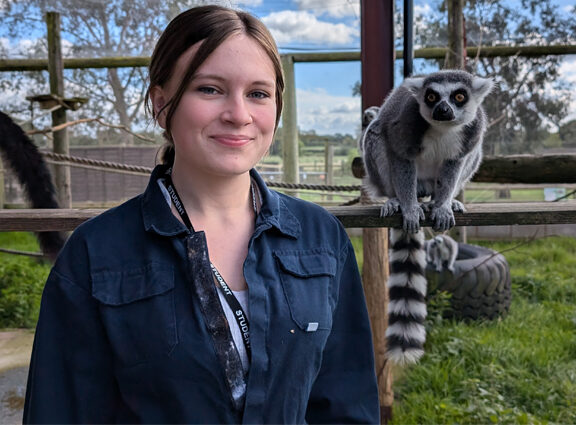 Photo of Animal Care student with Ring-Tailed Lemur