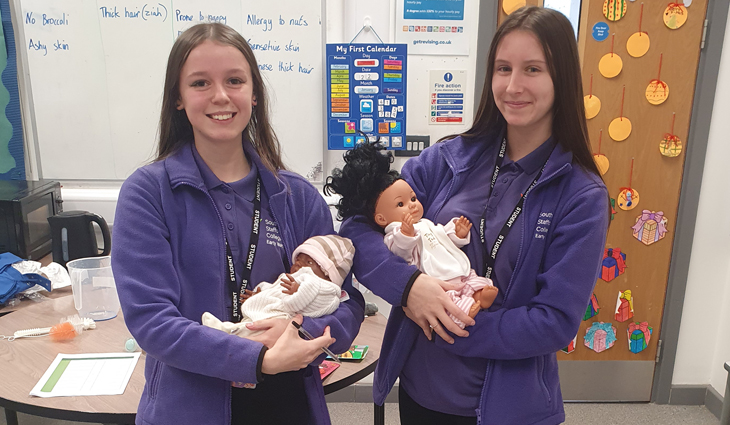 Level 2 Early Years students at Cannock holding babies