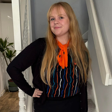 Photo of former Travel and Tourism student Ellie Bolton wearing Hays Travel uniform