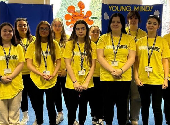 Introduction to College Students Wearing Young Minds T-Shirts