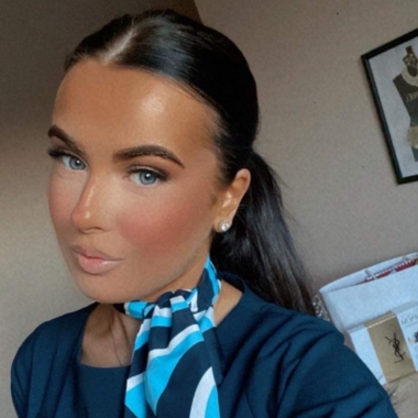 Photo of former Travel and Tourism student Mia Carter wearing TUI uniform