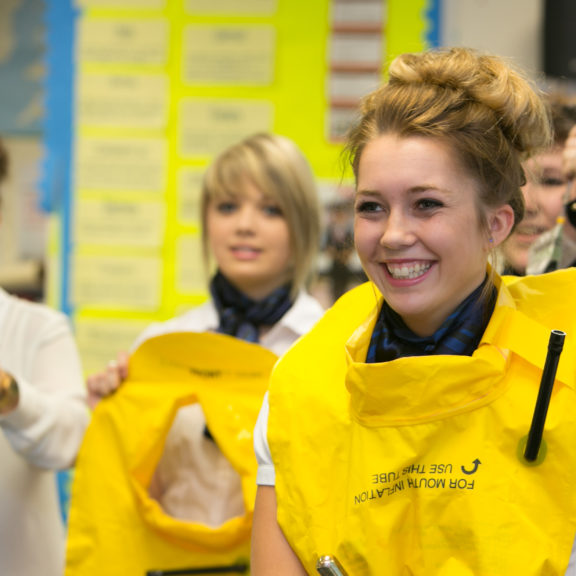 Travel student wearing life vest