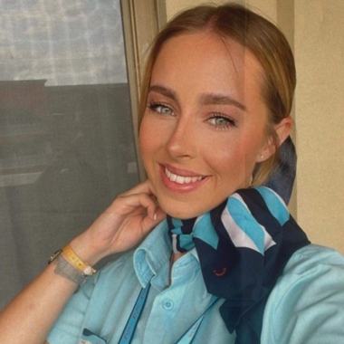 Photo of former Travel and Tourism student Rebecca Green wearing TUI uniform