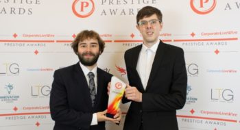 Former students Ben and Callum from FootFox Productions holding an award