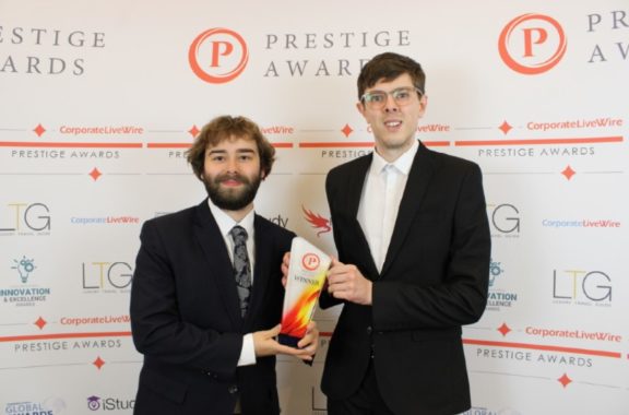 Former students Ben and Callum from FootFox Productions holding an award