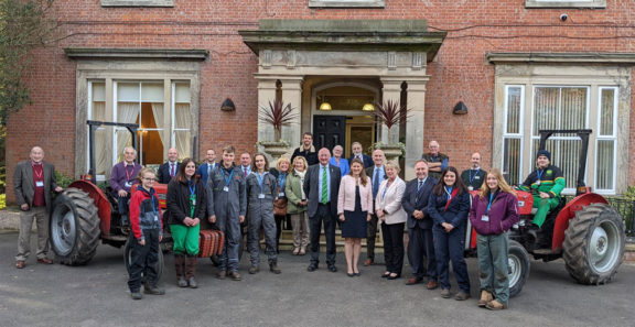 Group of staff, current and former students stood outside Rodbaston Hall