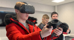 Students playing with VR glasses at an open day