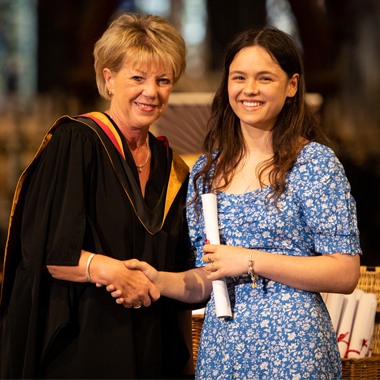 Photo of Layla Bate at student awards shaking hands with Principal Claire Boliver
