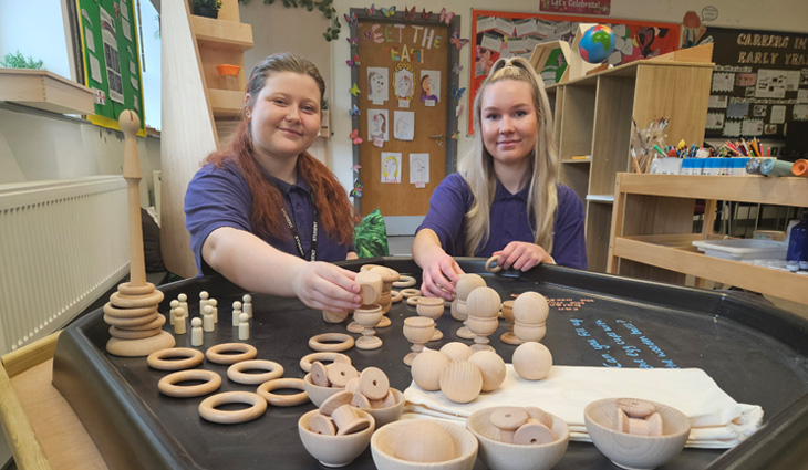 Two Early Years students playing with new T Level equipment