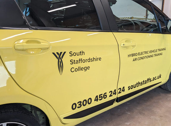 Electric Yellow Toyota Yaris in Automotive Training Centre