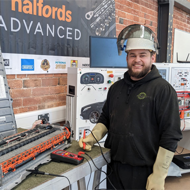 Photograph of Jack Burn inside the colleges Automotive Training Centre