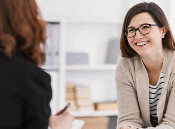 Woman smiling during counselling session