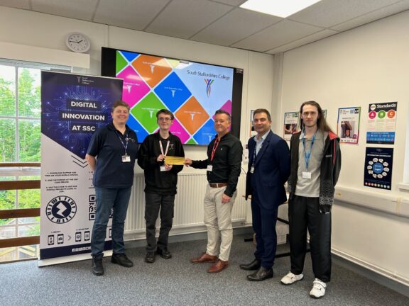 Curtis being presented by Jisc £100 Amazon voucher