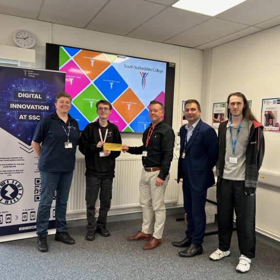 Curtis being presented by Jisc £100 Amazon voucher