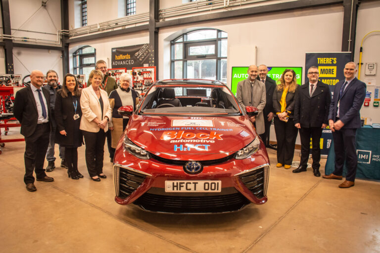 Young lady sat inside hydrogen powered car